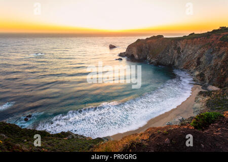 Sunset over The Pacific Ocean at Andrew Molera State Park south of Monterey, Big Sur, California, United States of America, North America Stock Photo