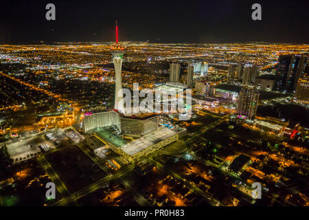 View of Las Vegas and Stratosphere Tower from helicopter at night, Las Vegas, Nevada, United States of America, North America Stock Photo