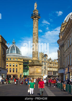 Grey's Monument at the top of Grey street in the town of Newcastle upon Tyne built to commemorate Earl Grey with shoppers and tourists Stock Photo