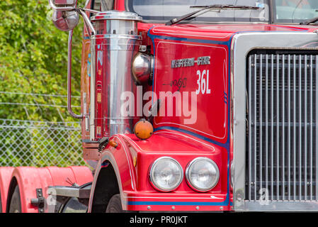 Partial view from in front of an Australian red and blue painted Western Star semi trailer, prime mover heavy truck Stock Photo