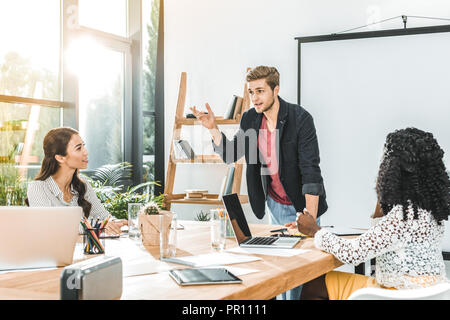 multiethinc business coworkers having conversation during conference in office Stock Photo
