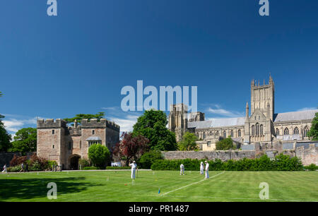 Wells Cathedral from Bishops Palace with croquet game, Wells, Somerset, England, United Kingdom, Europe Stock Photo