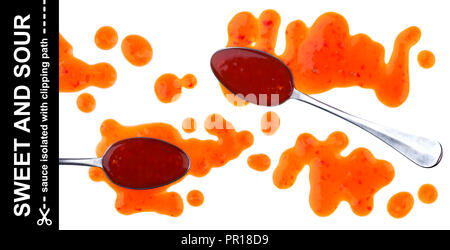 Sweet and sour sauce. Splashes and spilled orange sauce with spoon isolated on white background with clipping path. Top view Stock Photo