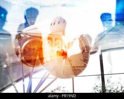 Take off of a modern aircraft and double exposure with silhouettes of passengers in the airport Stock Photo