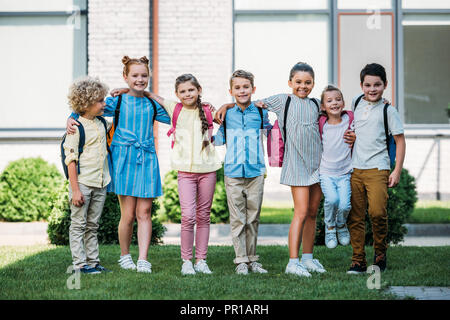 Group Of Elementary Age Schoolchildren Standing Outside Stock Photo - Alamy