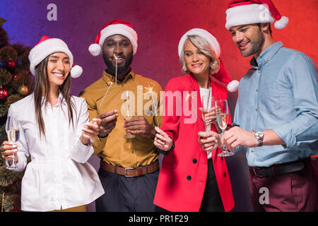 happy multicultural businesspeople celebrating at new year corporate party Stock Photo