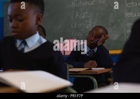 Schoolkid sitting in the classroom at school Stock Photo