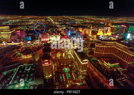 Las Vegas, Nevada, United States - August 18, 2018: aerial view of Las Vegas cityscape illuminated by night. Scenic flight over High Roller, Caesars Palace, Flamingo, The Paris Casino and Hotel. Stock Photo