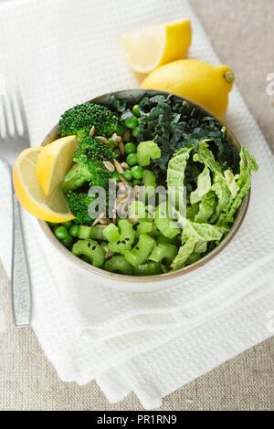Various green vegetables in a bowl. Stock Photo