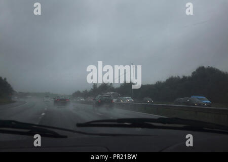 Traffic In Heavy Rain On M3 Southern England View Through Windscreen Stock Photo