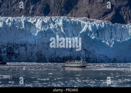 Glacier Bay, Alaska USA - Aug 17, 2018. A small boat approching closely to the Glacier bay Stock Photo