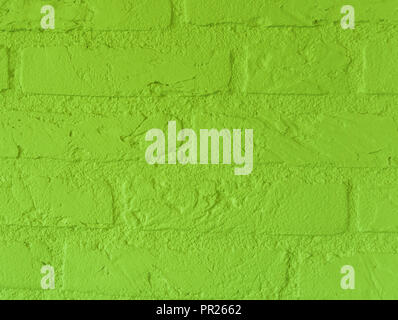 Modern vibrant Lime green stone brick wall with big bricks close up vintage background pattern Stock Photo