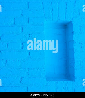 Modern neon blue colored brick wall texture background with empty framework opening Stock Photo