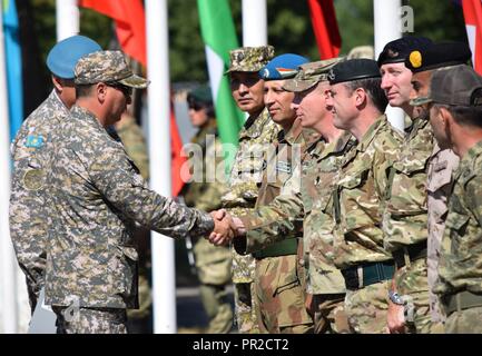 Maj. Gen. Murat Bektanov, Kazakhstan Land Forces commander, greets representatives from each nation participating in Exercise Steppe Eagle 17 during the opening ceremony July 22, 2017, at Illisky Training Center, Kazakhstan. Stock Photo