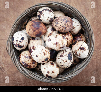 Quail eggs on wooden table top view Stock Photo