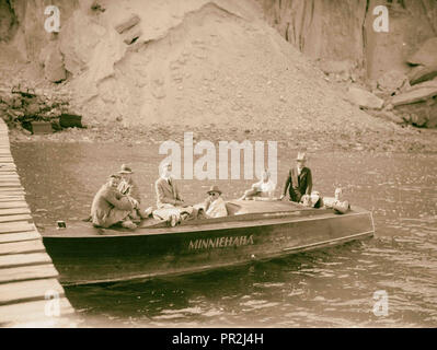 Motor boat trip around the Dead Sea. The speed boat at Jebel Usdum. Photo shows John D. Whiting (with hat) in back seat. 1920 Stock Photo