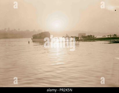 Iraq. (Mesopotamia). Baghdad. River scenes on the Tigris. The Tigris. Sunset silhouette. Horses coming down to the river Stock Photo