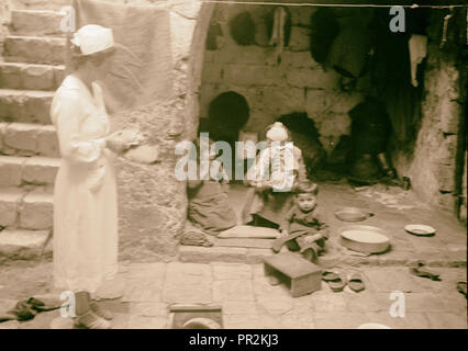 The raising of the siege of Jerusalem. Scene in the courtyard of a poor Moslem [i.e., Muslim] Home, showing Mrs. F. Vester Stock Photo