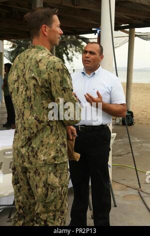 UERTO CASTILLA, Honduras (July 24, 2017) U.S. Navy Capt. Steven Stacy, mission commander of Southern Partnership Station 17, speaks with Colón Department Governor Carlos Ramón Aguilar Guifarro during an opening ceremony at Puerto Castilla, Honduras. SPS-EPF 17 is a U.S. Navy deployment, executed by U.S. Naval Forces Southern Command/U.S. 4th Fleet, focused on subject matter expert exchanges with partner nation militaries and security forces in Central and South America. Stock Photo