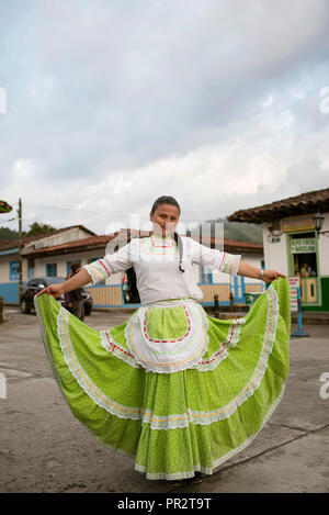 Portrait of a colombian woman posing for the camera in traditional clothing. Plaza de Bolivar, Salento, Colombia. Editorial use only. Sep 2018 Stock Photo