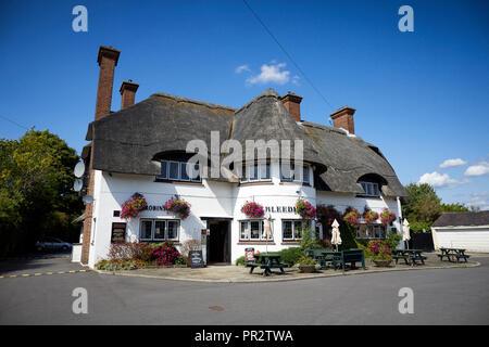 Grade II listed public house vernacular revival style picturesque thatched roofed country pub Bleeding Wolf in Scholar Green, Cheshire  Robinsons Brew