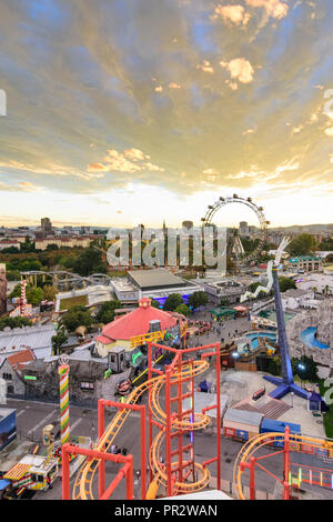 Wien, Vienna: rides, roller coaster, Riesenrad (Ferris Wheel) in Prater Amusement park, view to city center, 02. Leopoldstadt, Wien, Austria Stock Photo