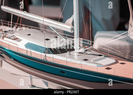 In scale, large models of the best luxury sailing yachts on the market. Billionaires, brokers and rich people lifestyle. Boating concept, collection. Stock Photo