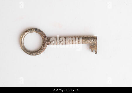 old rusty key isolated on white background -   - Stock Photo