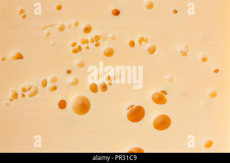 Texture of cheese with holes Stock Photo