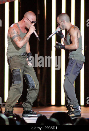 Wisin (L) and Yandel (R) with the latin reggaeton group Wisin Y Yandel perform in concert at the American Airlines Arena in Miami on September 17, 2009. Stock Photo