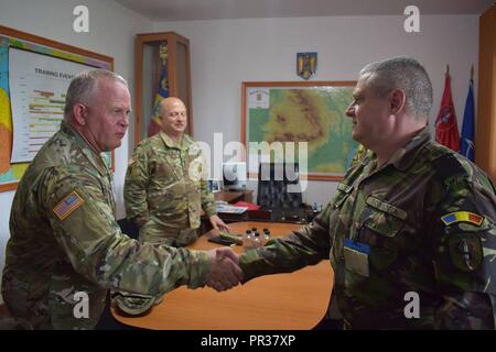 Maj. Gen. Robert E. Livingston, Jr., the adjutant general of the South Carolina National Guard, and Command Sgt. Maj. Russell A. Vickery, state command sergeant major, meet Command Sgt. Maj. Dan Bittel and Brig. Gen. Gheorghita Vlad at Joint National Training Center, Cincu, Romania. Livingston and Vickery were in Cincu to visit South Carolina Army National Guard Soldiers deployed for Operation Resolute Castle 17. Resolute Castle is an exercise employing the South Carolina Army National Guard, U.S. Army Reserve, Navy Seabees, U.K. Royal Engineers, and Romanian Land Forces to build relationships Stock Photo