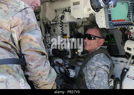 Congressman Earl L. 'Buddy' Carter, U.S. Representative of Georgia's 1st District, observes and participates in gunnery from inside a tank at Red Cloud A range with 3rd Infantry Division Soldiers July 31, 2017 on Fort Stewart, Georgia. Cater  was transported to the range in a Black Hawk helicopter with commanders and leaders of the Marne Division as part of his visit to interact with Soldiers and understand the training conducted on Fort Stewart. Stock Photo