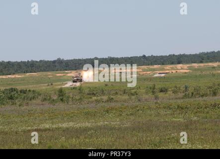 Congressman Earl L. 'Buddy' Carter, U.S. Representative of Georgia's 1st District, participates in gunnery from inside a tank at Red Cloud A range with 3rd Infantry Division Soldiers July 31, 2017 on Fort Stewart, Georgia. Cater visited with commanders and leaders of the Marne Division, interacted with Soldiers and learned about the training conducted on Fort Stewart. Stock Photo