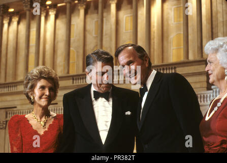 President Ronald Reagan and First Lady Nancy Reagan at a dinner in Washington where President Reagan endorses Vice President George HW Bush for president.  Photograph by Dennis Brack bb24 Stock Photo