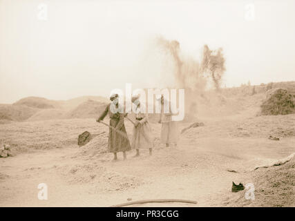 Halhul village at kilometer 30 on Hebron road Threshing floors of Halhul showing sun through a haze with Neby Yunis shrine Stock Photo