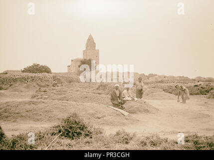 Halhul village at kilometer 30 on Hebron road Threshing floors of Halhul showing sun through a haze with Neby Yunis shrine Stock Photo