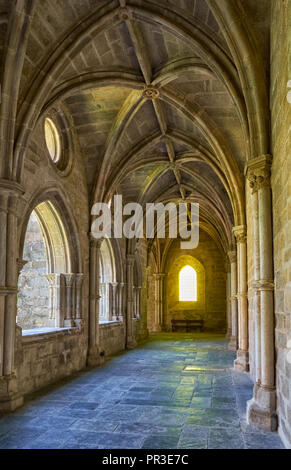 EVORA, PORTUGAL - JULY 01, 2016:  The interior of medieval cloister of Evora Cathedral (Se) with the massive arcade made of granite. Portugal Stock Photo