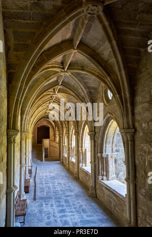 EVORA, PORTUGAL - JULY 01, 2016:  The interior of medieval cloister of Evora Cathedral (Se) with the massive arcade made of granite. Portugal Stock Photo