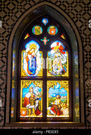 SINTRA, PORTUGAL - JULY 03, 2016: The stained glass lancet window showing historic and religious scenes in the Palace of Pena. Sintra. Portugal