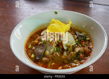 thin rice noodle with pork in spicy soup on bowl Stock Photo