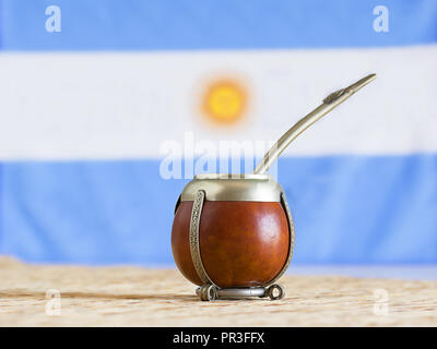 Premium Photo  Yerba mate tea and argentina flag on wooden table with copy  space. traditional argentinian beverage