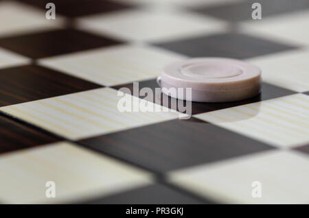 Checkerboard with checkers. Game concept. Board game. Hobby. Stock Photo