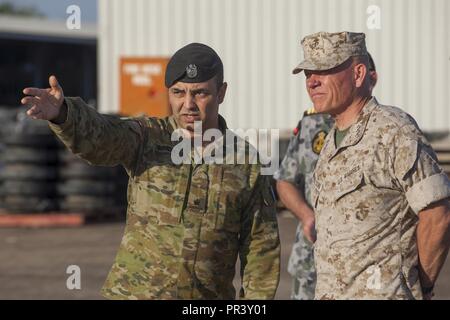 AUSTRALIAN ARMY BASE ROBORTSON BARRACKS, Australia— U.S. Marine Lt. Gen. Lawrence Nicholson, commanding general for III Marine Expeditionary Force, talks to an Australian Defence Force (ADF) soldier on July 26, 2017. Nicholson inspected facilities and warehouses provided by the ADF in order to improve future iterations of Marine Rotational Force-Darwin. Stock Photo