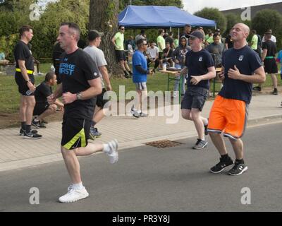 Soldiers and family members of the 12th Combat Aviation Brigade and U.S. Army Garrison Ansbach took part in the Windy25 5k Memorial Run around the Katterbach Army Airfield, Ansbach, Germany July 28, 2017. Windy25 was the call sign of the aircraft from Fox Company, 159th Aviation Regiment 'Big Windy'. They made the ultimate sacrifice while serving in Operation Enduring Freedom, Afghanistan on 6 April 2005. The Windy25 Memorial Fund was   created to honor their legacy by actively supporting the families and survivors of all of our nation's heroes. Stock Photo