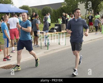 Soldiers and family members of the 12th Combat Aviation Brigade and U.S. Army Garrison Ansbach took part in the Windy25 5k Memorial Run around the Katterbach Army Airfield, Ansbach, Germany July 28, 2017. Windy25 was the call sign of the aircraft from Fox Company, 159th Aviation Regiment 'Big Windy'. They made the ultimate sacrifice while serving in Operation Enduring Freedom, Afghanistan on 6 April 2005. The Windy25 Memorial Fund was   created to honor their legacy by actively supporting the families and survivors of all of our nation's heroes. Stock Photo