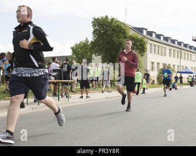 Soldiers and family members of the 12th Combat Aviation Brigade and U.S. Army Garrison Ansbach took part in the Windy25 5k Memorial Run around the Katterbach Army Airfield, Ansbach, Germany July 28, 2017. Windy25 was the call sign of the aircraft from Fox Company, 159th Aviation Regiment 'Big Windy'. They made the ultimate sacrifice while serving in Operation Enduring Freedom, Afghanistan on 6 April 2005. The Windy25 Memorial Fund was   created to honor their legacy by actively supporting the families and survivors of all of our nation's heroes. Stock Photo