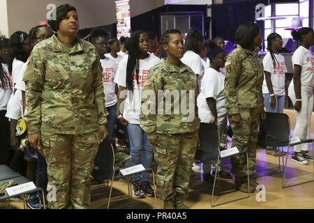 U.S. Army and U.S. Army Reserve Soldiers march with their mentees during the opening ceremony at the Steve and Marjorie Harvey 'Girls who Rule the World” mentoring camp at World Changes Church in Ga., July 26, 2017. From July 26-30, the Harvey's held their annual youth enrichment program for young ladies ages 13-18 at The Rock Ranch, tucked away in rural Georgia about an hour southwest of Atlanta. The goal of this camp was to create leaders and empower young women to pursue excellence in every area of their lives. The mentors during the camp were active Army and U.S. Army Reserve Soldiers and  Stock Photo