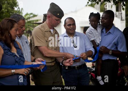U.S. Marine Maj. Theodore R. Smith, the officer in charge of the Logistics Combat Element, Special Purpose Marine Air-Ground Task Force - Southern Command, cuts a ribbon to mark the completion of a remodeling project at the Taufick Bendeck Elementary School in Trujillo, Honduras, July 27, 2017. The Marines are conducting infrastructure improvement projects at local schools in Trujillo at the request of the government of Honduras. The Marines and sailors of SPMAGTF-SC are deployed to Central America to conduct security cooperation training and engineering projects with their counterparts in sev Stock Photo