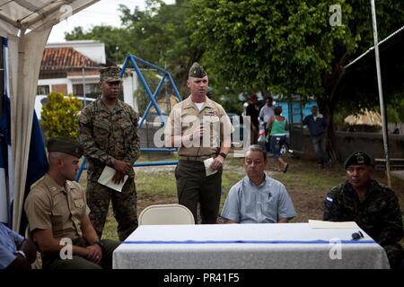 U.S. Marine Maj. Theodore R. Smith, the officer in charge of the Logistics Combat Element, Special Purpose Marine Air-Ground Task Force - Southern Command, speaks at a ribbon cutting ceremony for the Taufick Bendeck Elementary School in Trujillo, Honduras, July 27, 2017. The Marines are conducting infrastructure improvement projects at local schools in Trujillo at the request of the government of Honduras. The Marines and sailors of SPMAGTF-SC are deployed to Central America to conduct security cooperation training and engineering projects with their counterparts in several Central American an Stock Photo