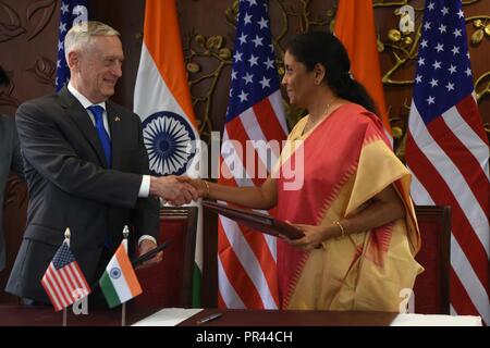 U.S. Defense Secretary James N. Mattis and Indian Defense Minister Nirmala Sitharaman shake hands after signing the COMCASA agreement between the United States and India, at the Indian Ministry of External Affairs, New Delhi, India, Sept. 6, 2018. Mattis met with his counterpart, along with U.S. Secretary of State Michael Pompeo and Indian Minister of External Affairs Sushma Swaraj for the first ever U.S.-India 2+2 ministerial dialogue. DoD Stock Photo